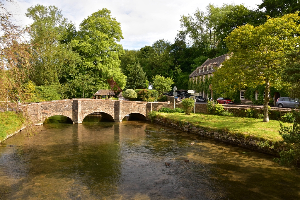 The River Coln Flowing through Bibury in the Cotswolds © essentially-england.com