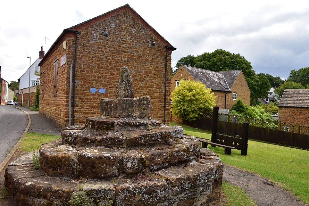 Brixworth Market Cross, Heritage Centre, and Stocks © essentially-england.com