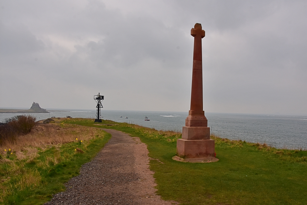 The Lindisfarne War Memorial, Shipping Beacon and Castle © essentially-england.com