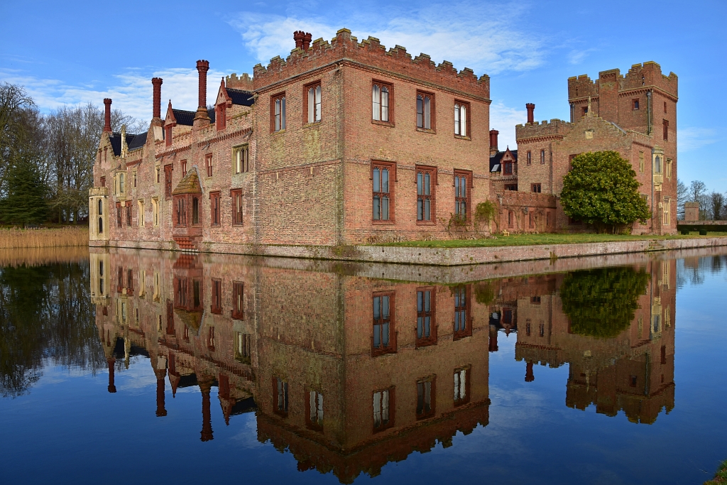 Oxburgh Hall Reflection in the Moat © essentially-england.com