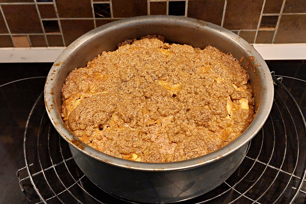 Apple Cake with Cinnamon Cooling in the Cake Tin © essentially-england.com