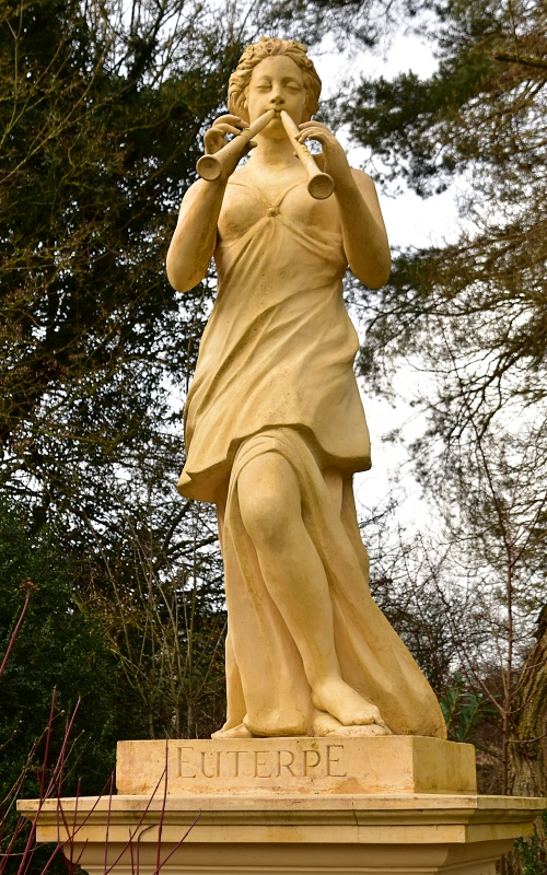 Euterpe Statue Beside the Doric Arch in Stowe Gardens © essentially-england.com