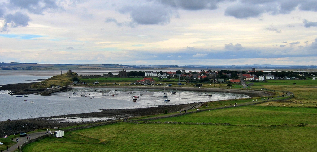 View Towards Lindisfarne Priory and Village from the Castle © essentially-england.com